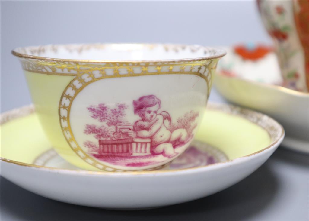 A Worcester cup and saucer, late 18th century, and a pair of Meissen outside printed coffee cups and saucers, largest saucer diameter 1